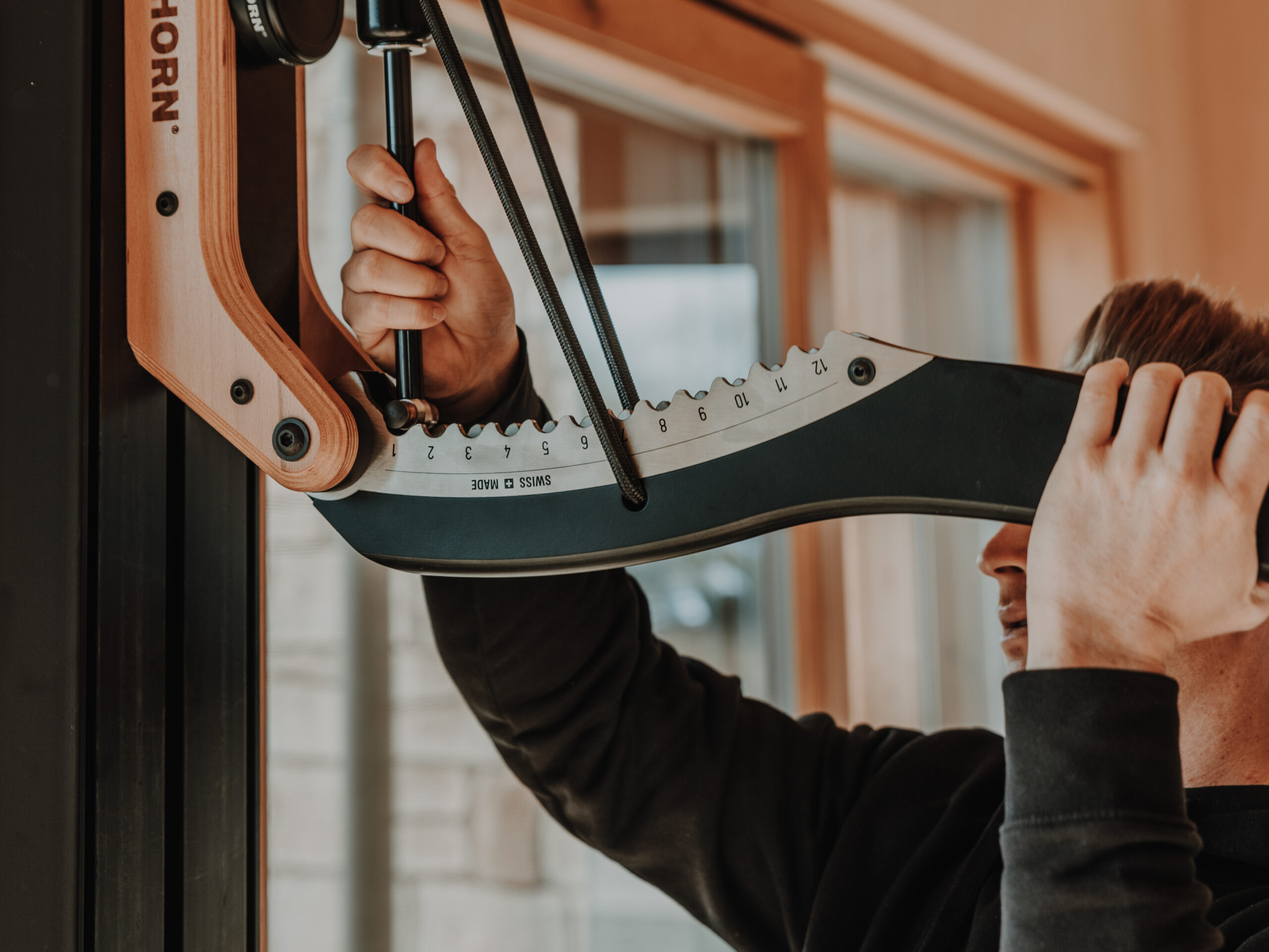 Why we rely on EISENHORN at TRIM-FIT 3 Man adjusting weights on the EISENHORN